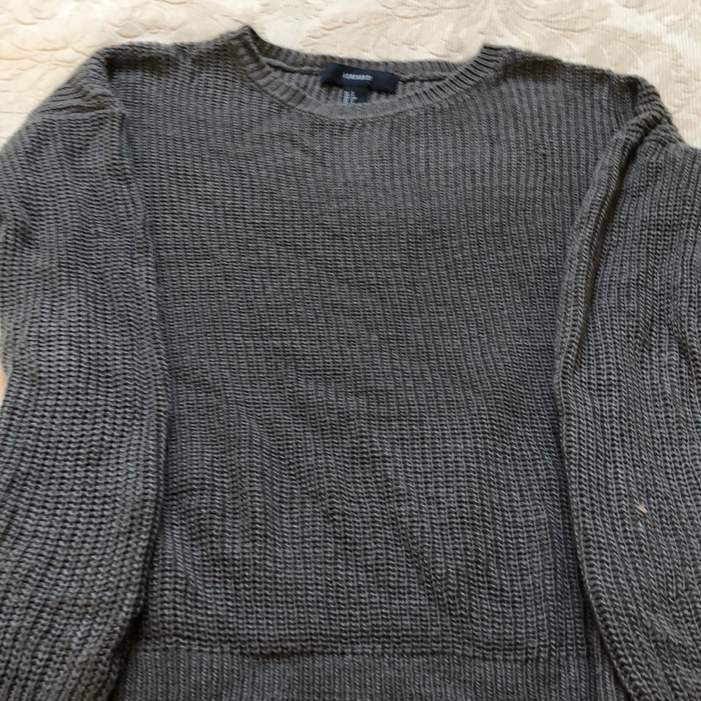 Gray sweater on the cropped side
